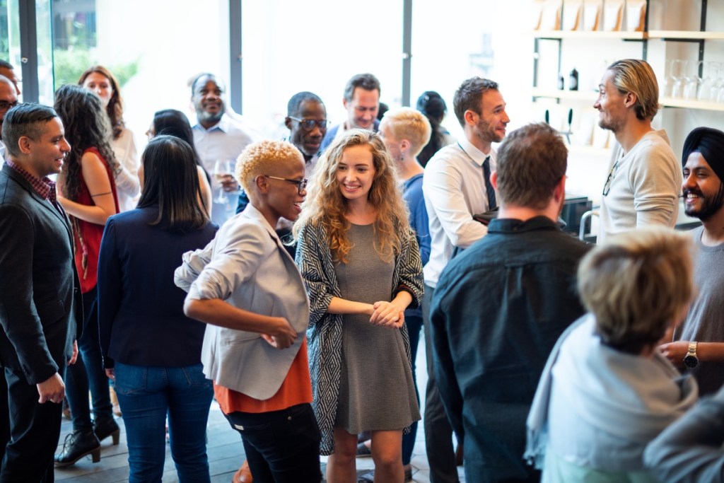 diverse group of professionals networking at an event